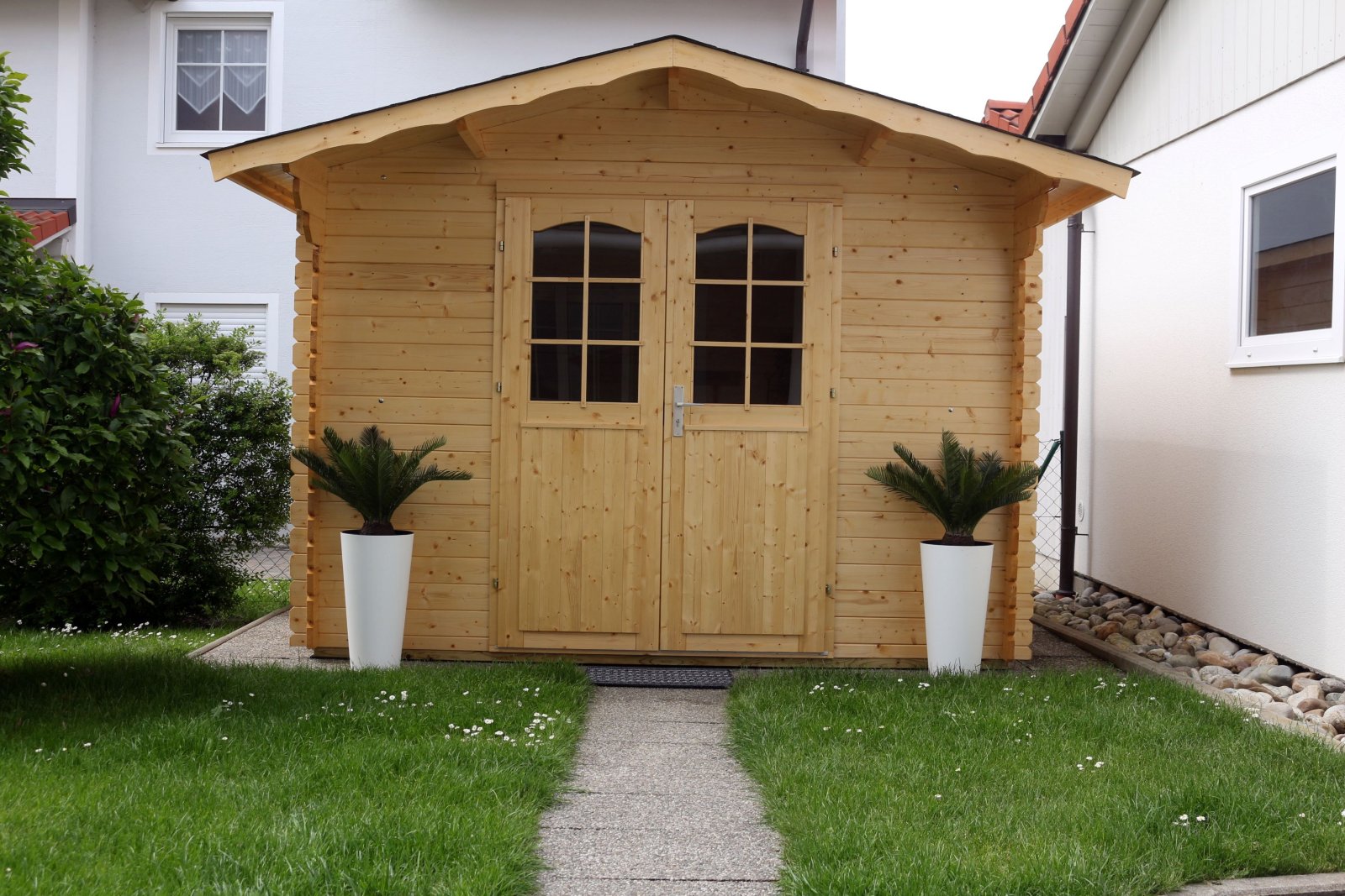 Multifunktionales Gartenhaus: Stauraum und Wohlfühloase in Holzbauweise